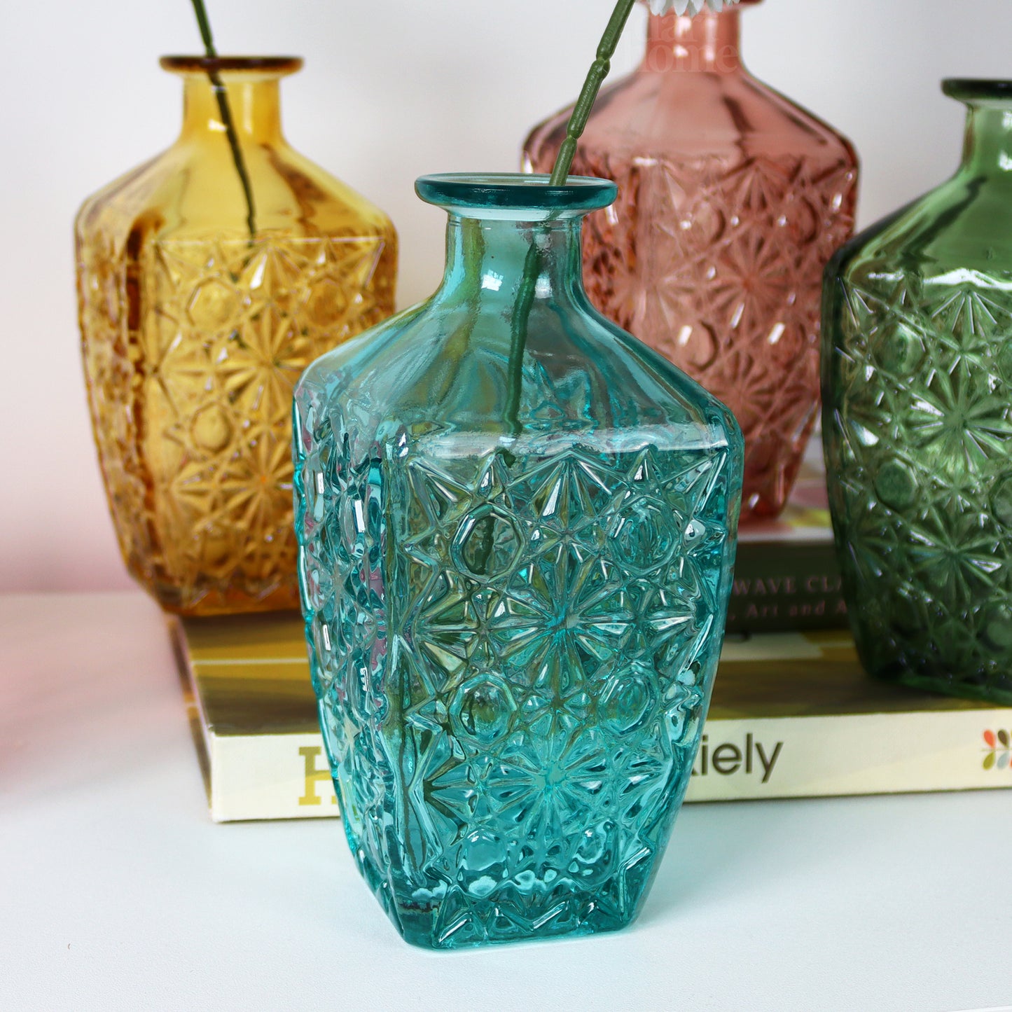 Set Of 4 Embossed Flower Coloured Bottles