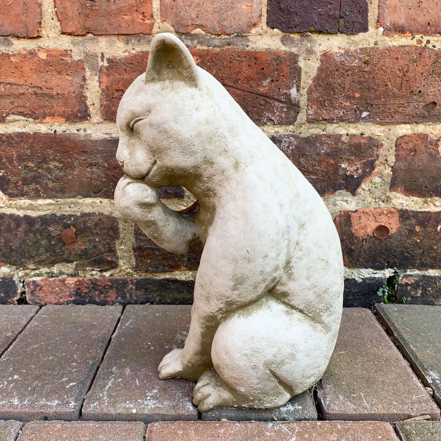 Stone Paw Licking Cat Garden Sculpture
