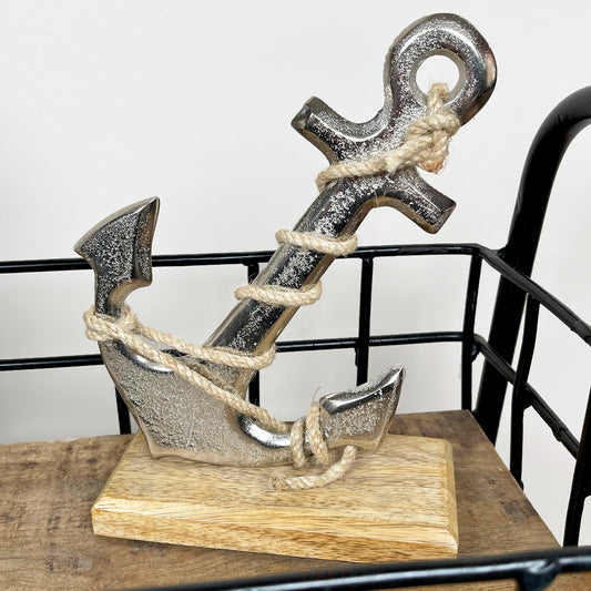 Silver Metal Anchor Ornament On Wooden Stand