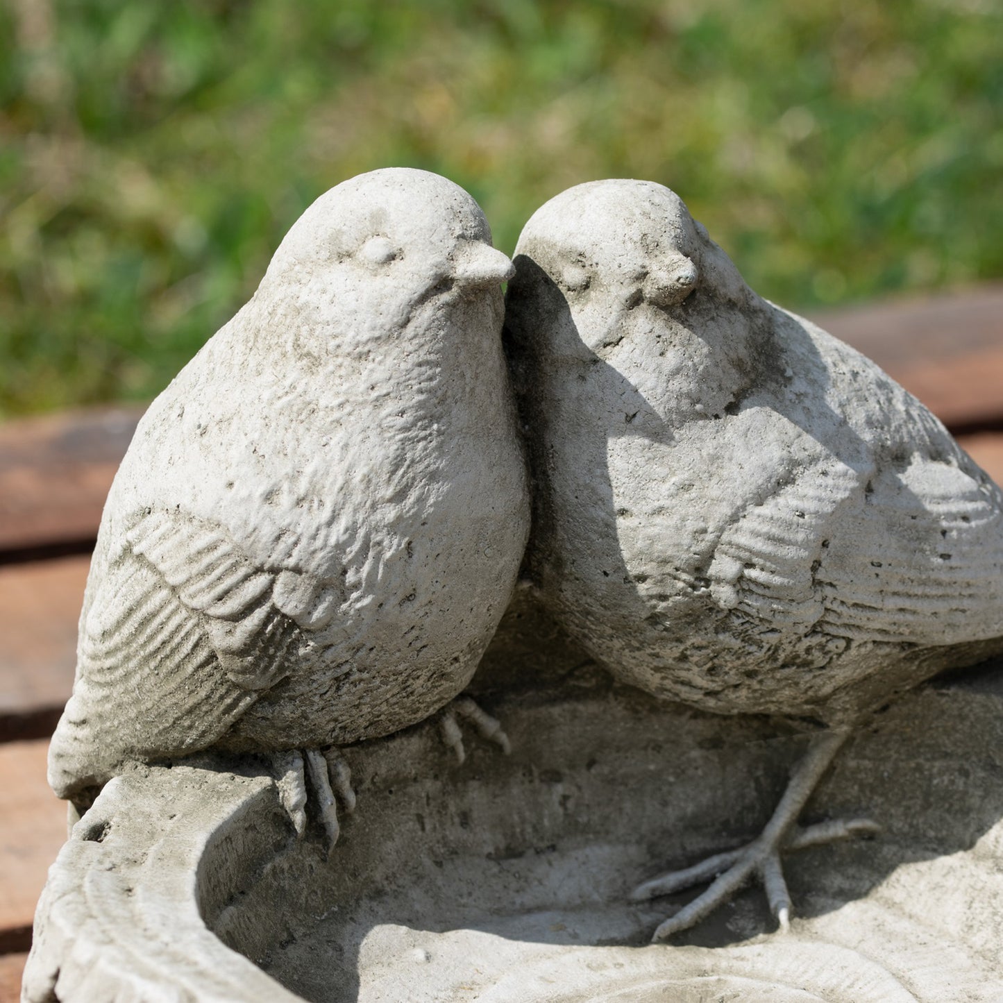 Stone Robins On Log Bird Feeder