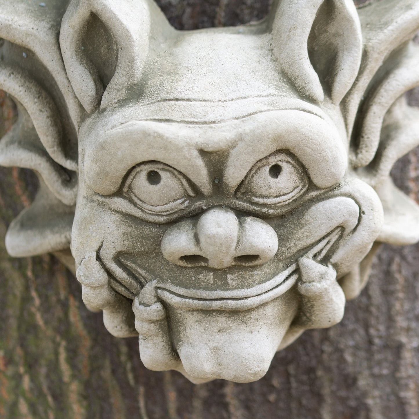 Stone Smiling Bony Finger Gremlin Wall Sculpture