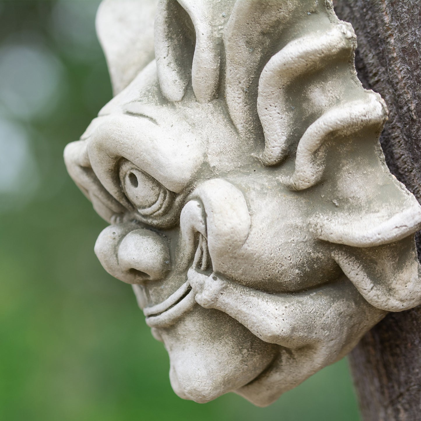 Stone Smiling Bony Finger Gremlin Wall Sculpture