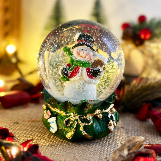 Snowman In Green Sack Snow Globe