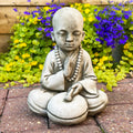 Stone Drummer Monk Sculpture