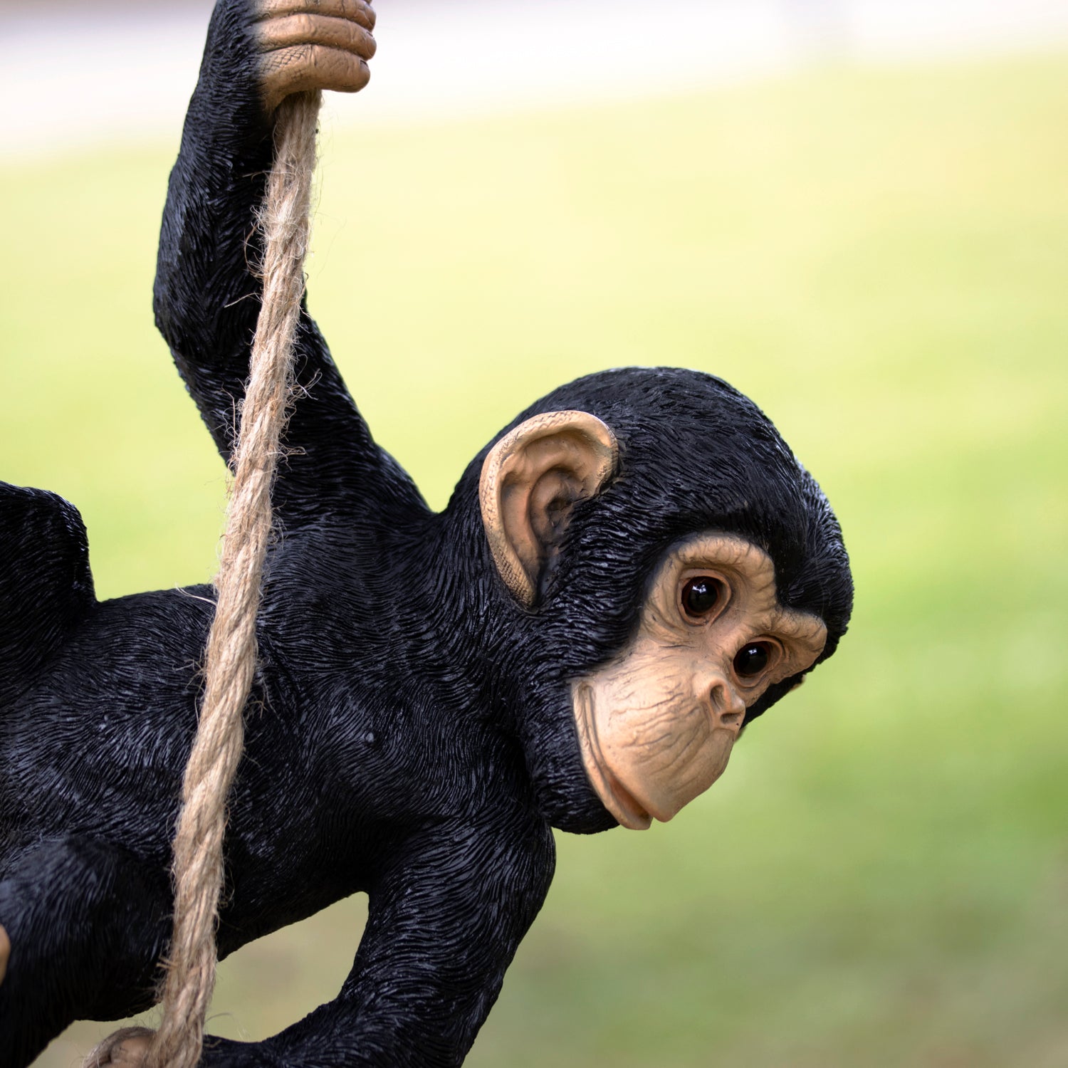 Black Swinging Monkey Garden Sculpture