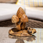 3 strawberry shaped bali mushrooms in a natural teak root wood finish