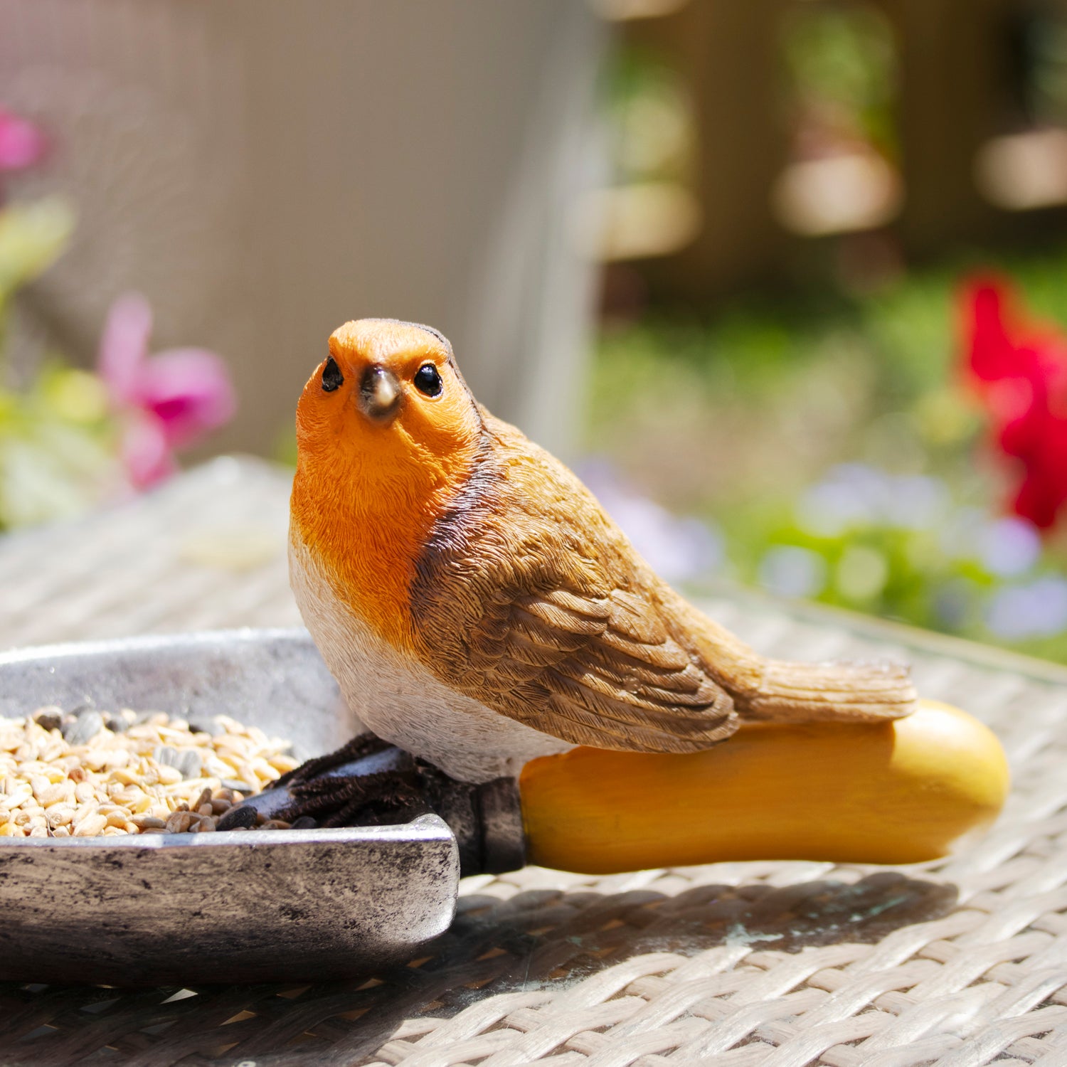 Robin On Trowel Bird Feeder