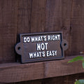 Black garden sign that says "do what's right not what's easy" in white block text