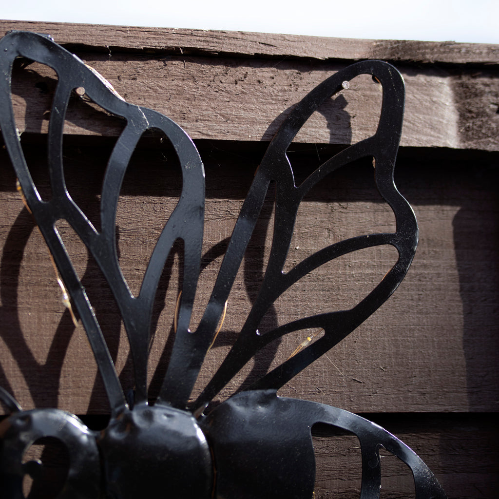 Black Metal Buzzy Bee Solar Wall Art