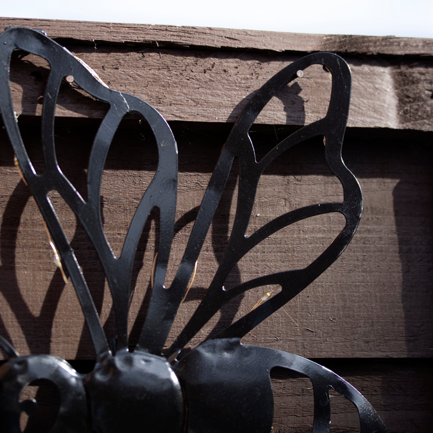 Black Metal Buzzy Bee Solar Wall Art