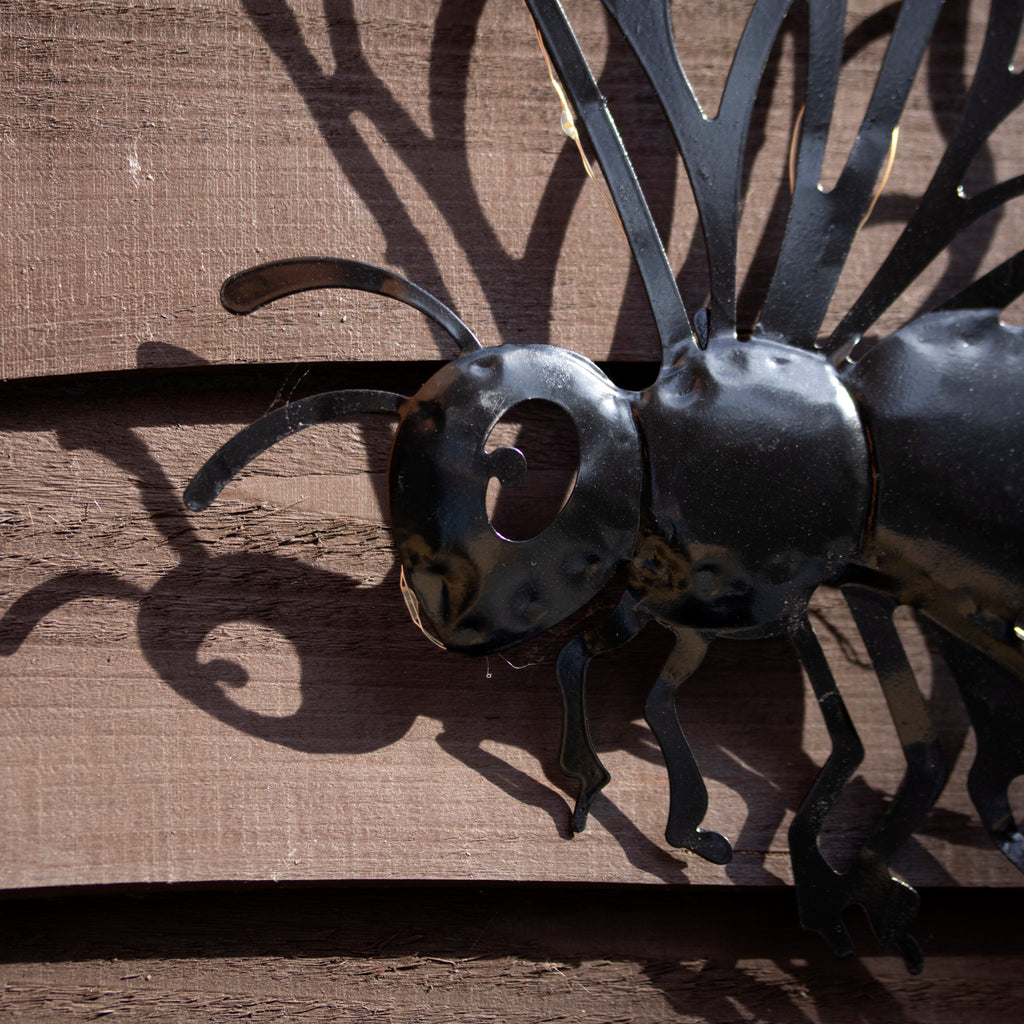 Black Metal Buzzy Bee Solar Wall Art