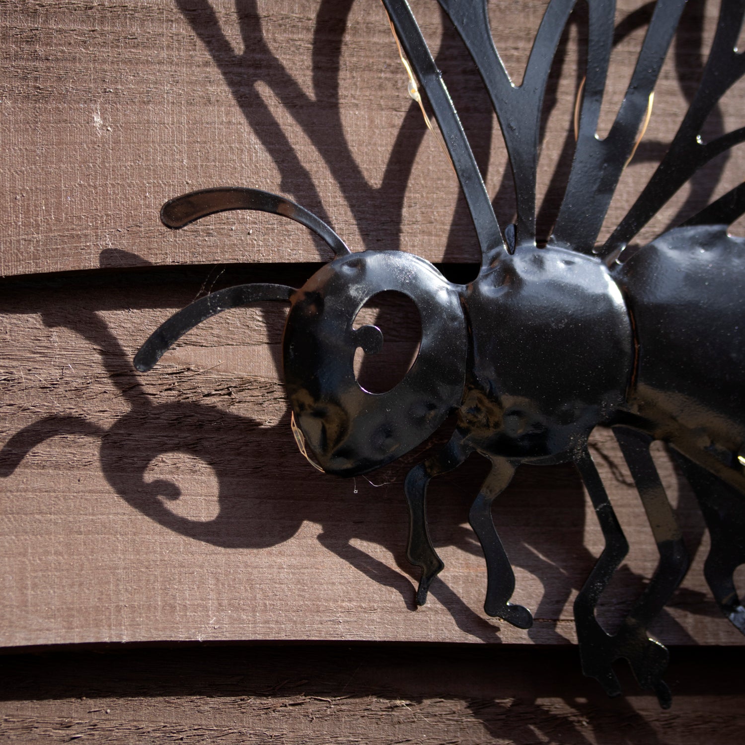 Black Metal Buzzy Bee Solar Wall Art