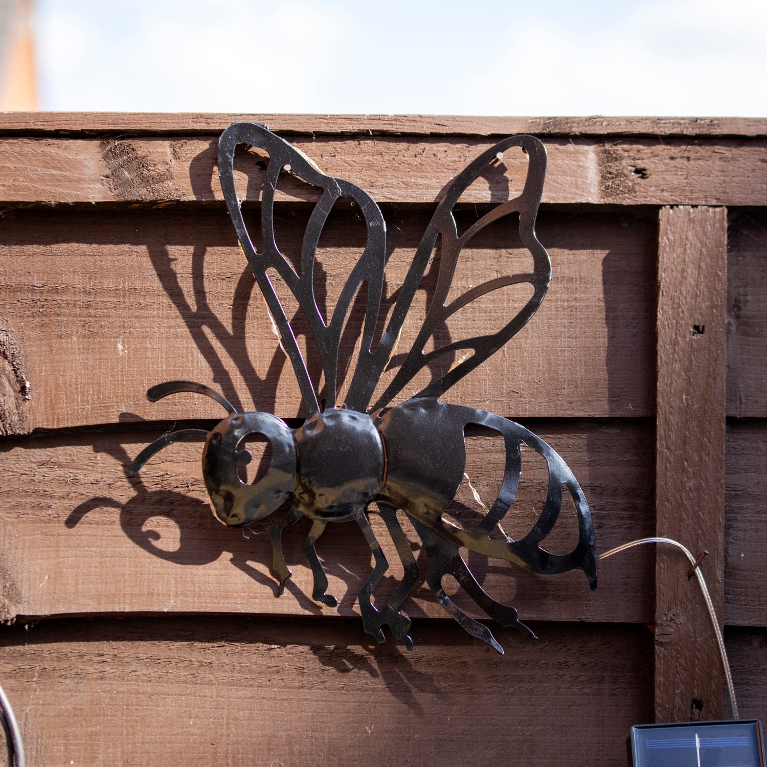 Black Metal Buzzy Bee Solar Wall Art