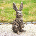 Rustic Wood Effect Hare Sculpture in a garden setting