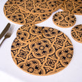 Round cork placemats with blue Mediterranean Tile patterns on a white surface.