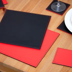 Set of 4 Red/Black Reversible Faux Leather Placemats & Coasters