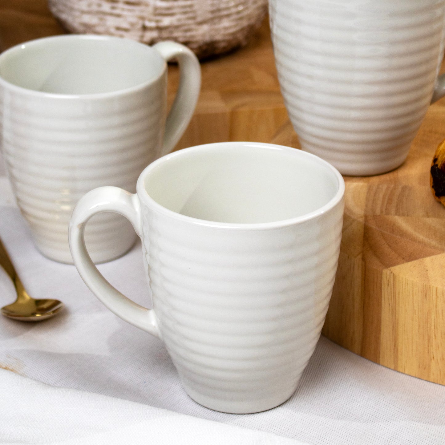 Set Of 4 Cream Embossed Rings Mugs