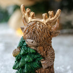 Brown Highland Cow With Christmas Tree Ornament
