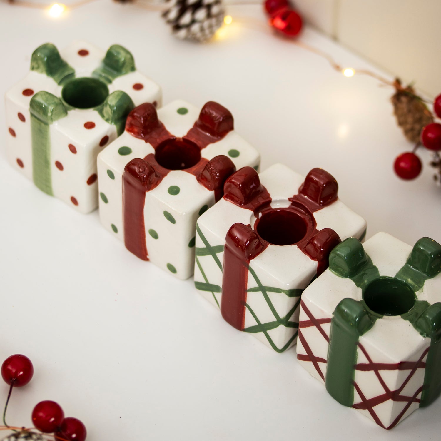Set Of 4 Christmas Present Candlestick Holders