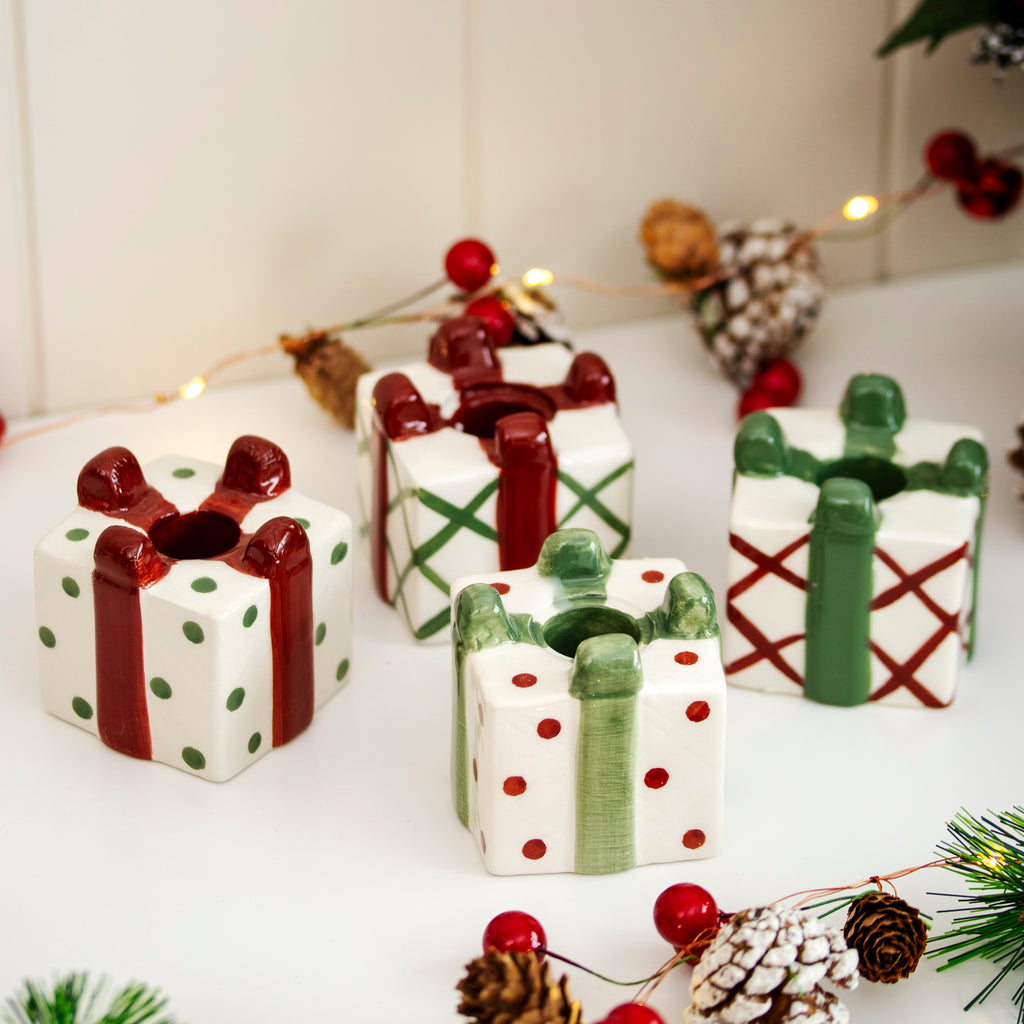 Set Of 4 Christmas Present Candlestick Holders