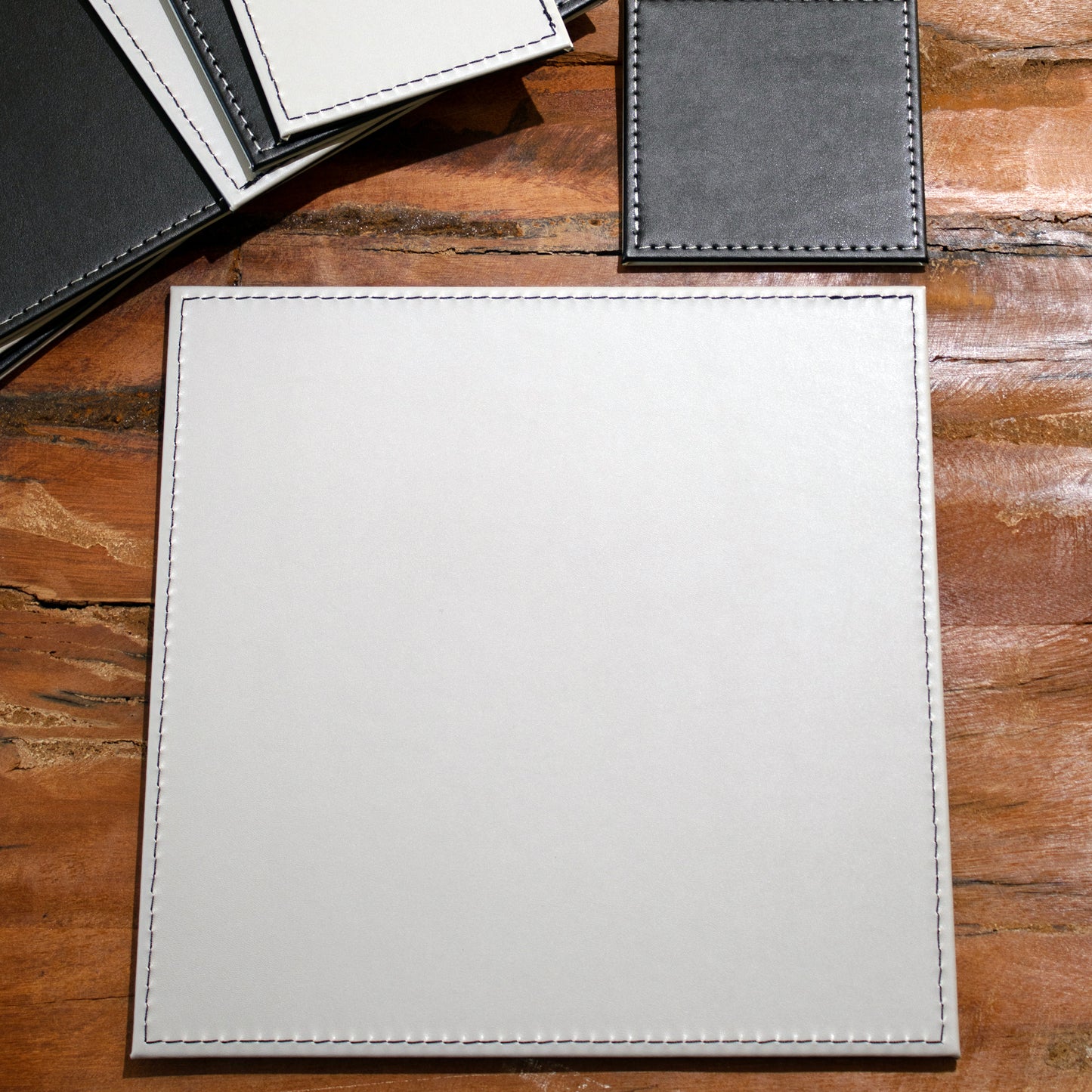 Set of 4 Reversible Black/Grey Faux Leather Placemats & Coasters