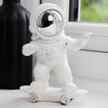 Skateboarding Astronaut Figure