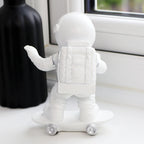 Skateboarding Astronaut Figure