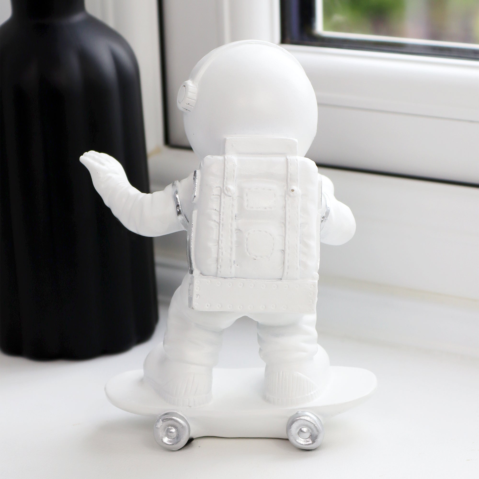 Skateboarding Astronaut Figure
