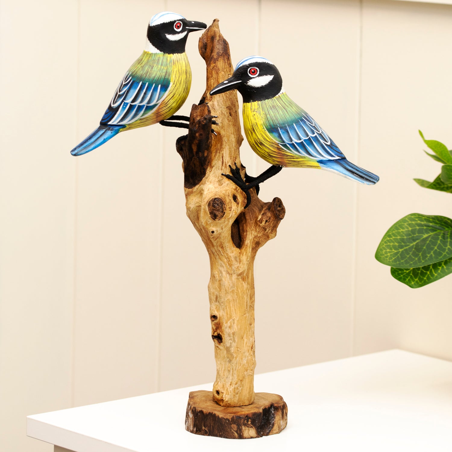 Foraging Blue Tits On Teak Root Tree Sculpture