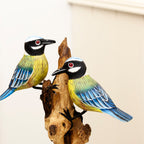 Foraging Blue Tits On Teak Root Tree Sculpture