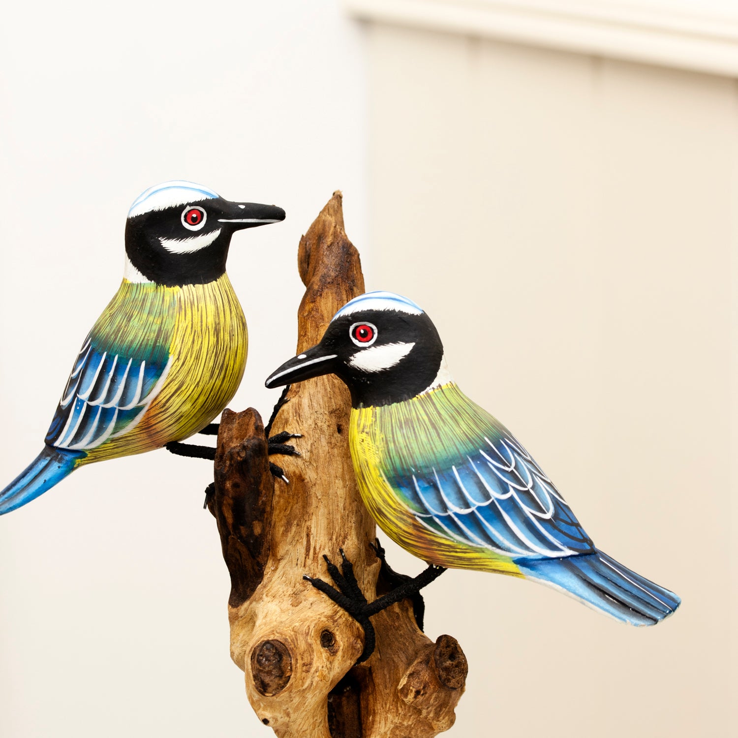 Foraging Blue Tits On Teak Root Tree Sculpture
