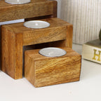 Set Of 4 Nesting Mango Wood Tea Light Holders With Candles