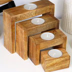 Set Of 4 Nesting Mango Wood Tea Light Holders With Candles