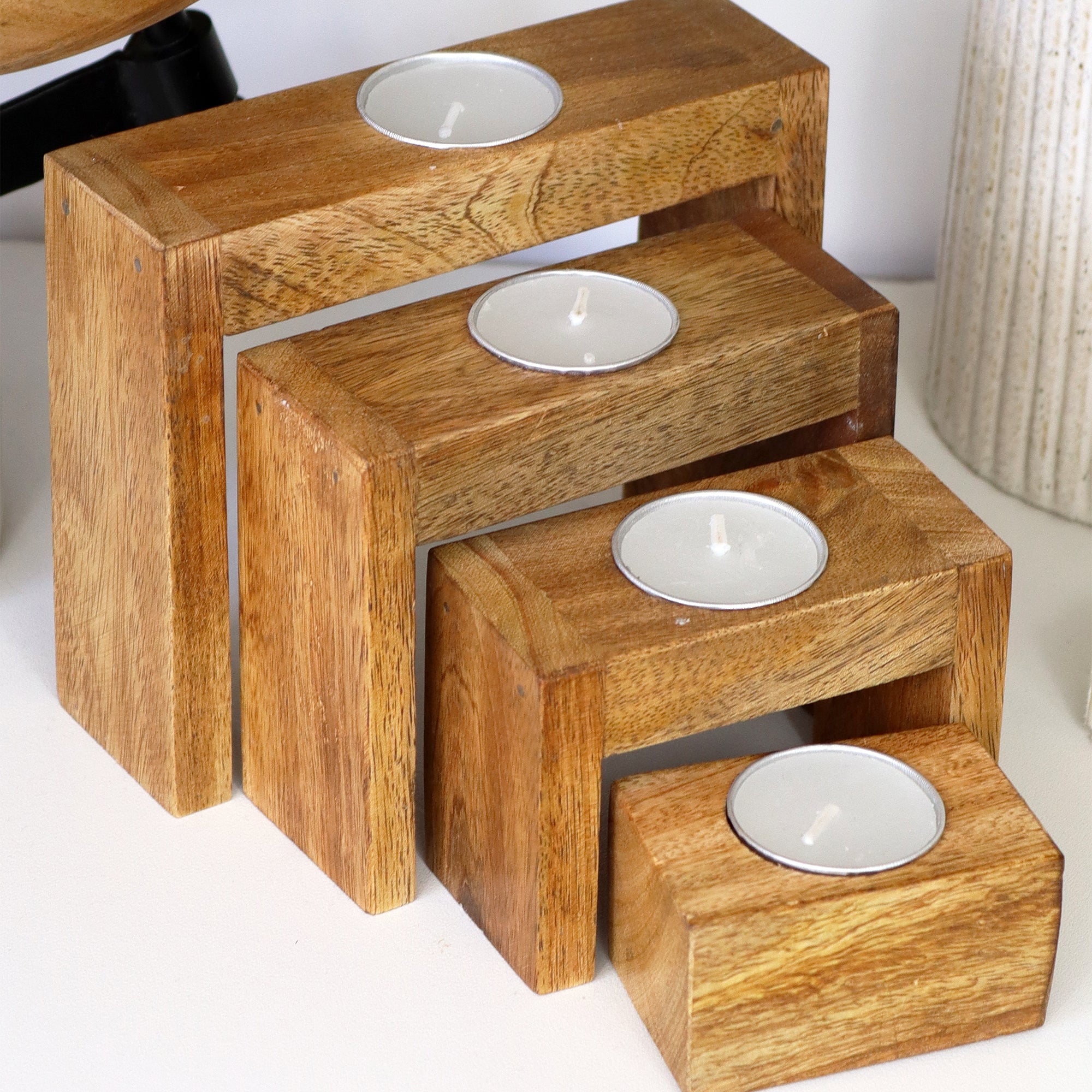 Set Of 4 Nesting Mango Wood Tea Light Holders With Candles