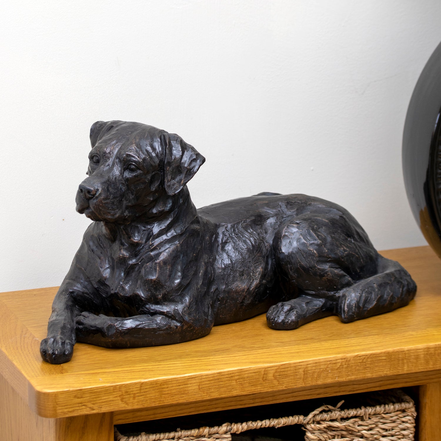 Black Laying Dog Sculpture