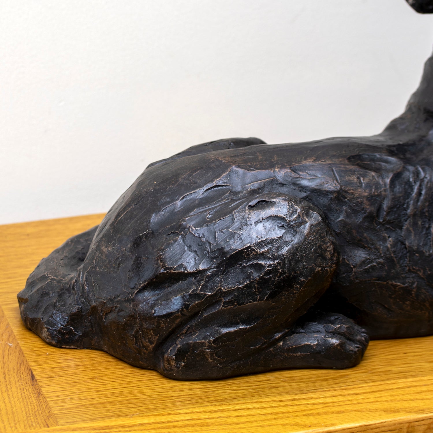 Black Laying Dog Sculpture