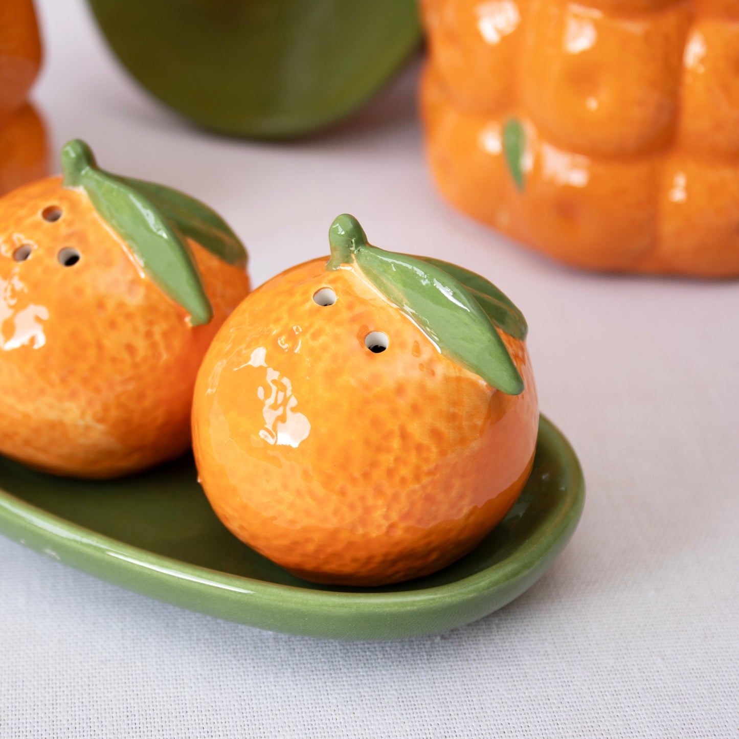 Orange Salt And Pepper Shakers With Tray