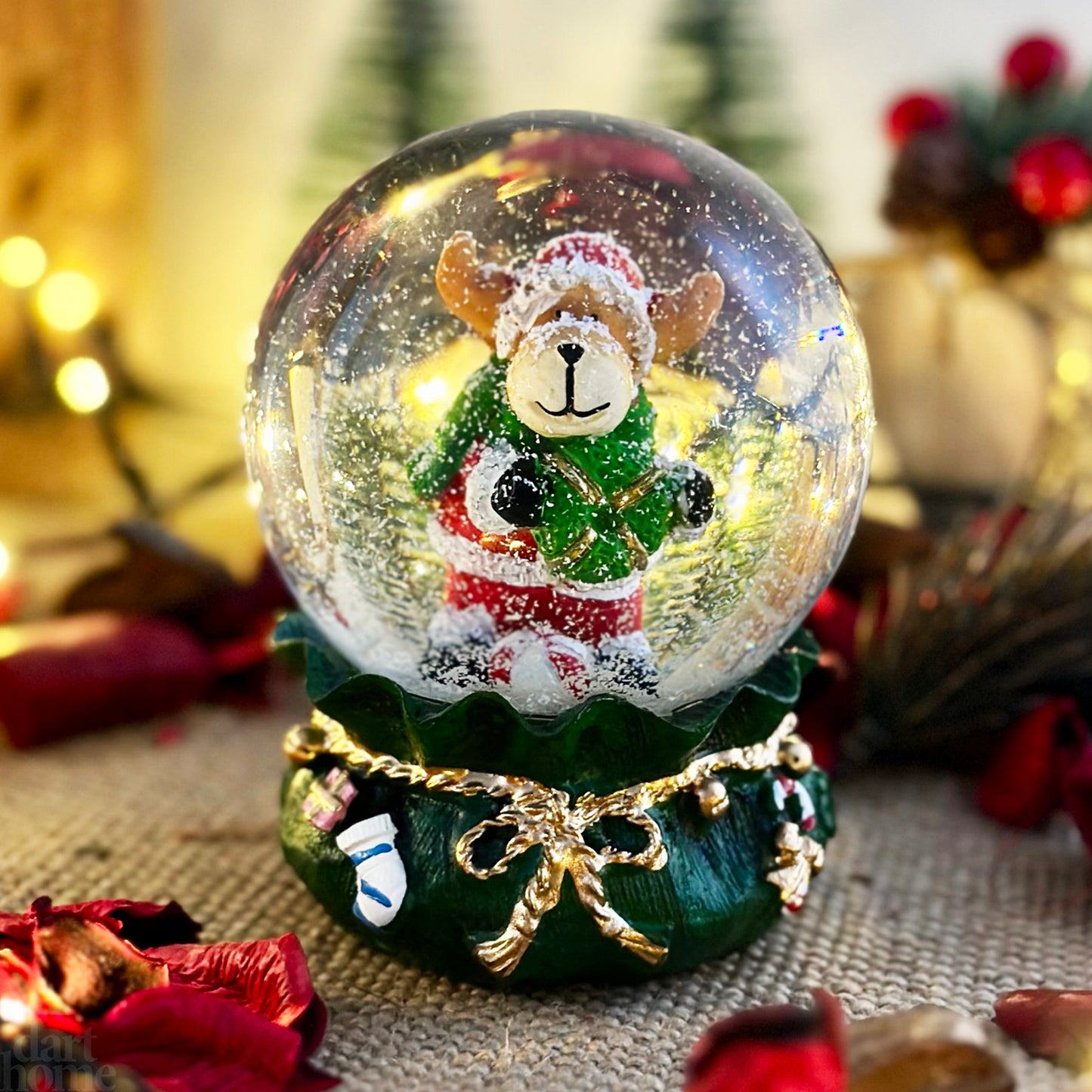 Reindeer In Green Sack Snow Globe