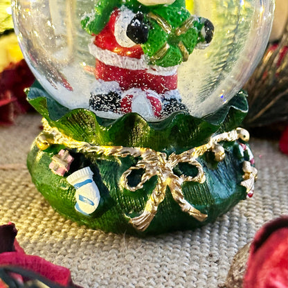 Reindeer In Green Sack Snow Globe