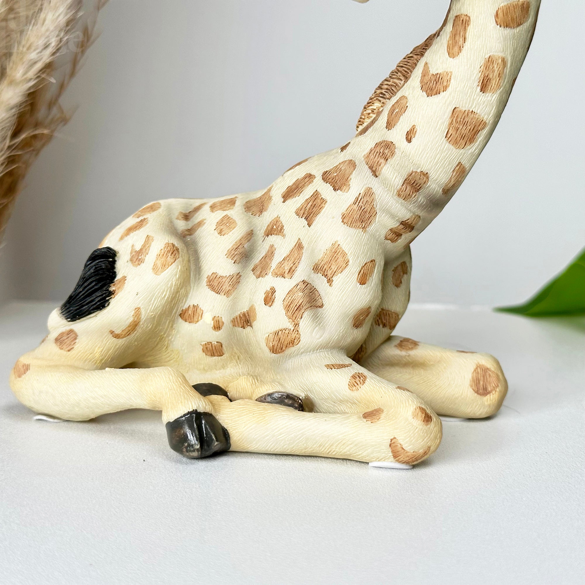 Lifelike Sitting Giraffe Ornament