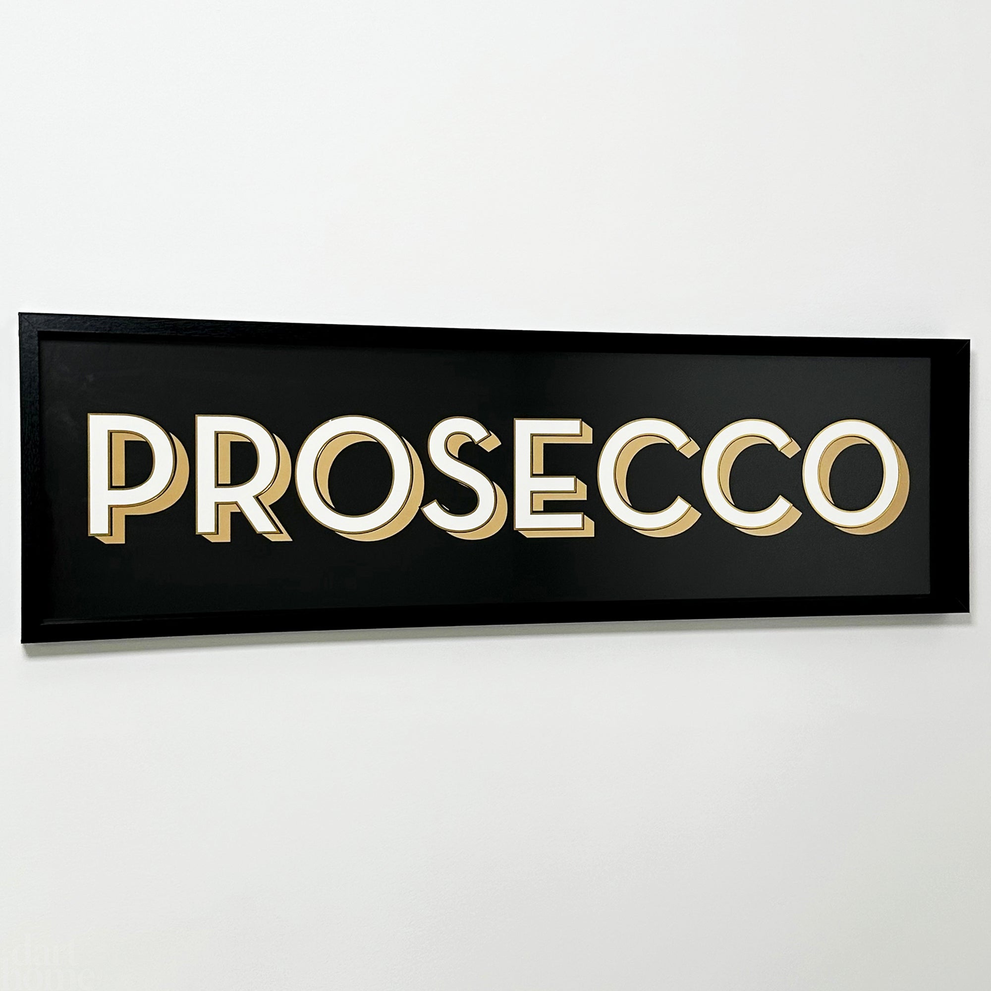 A black framed wall mounted 'Prosecco' bar sign with block typography and a 3D effect, featuring white and gold letters on a black background.