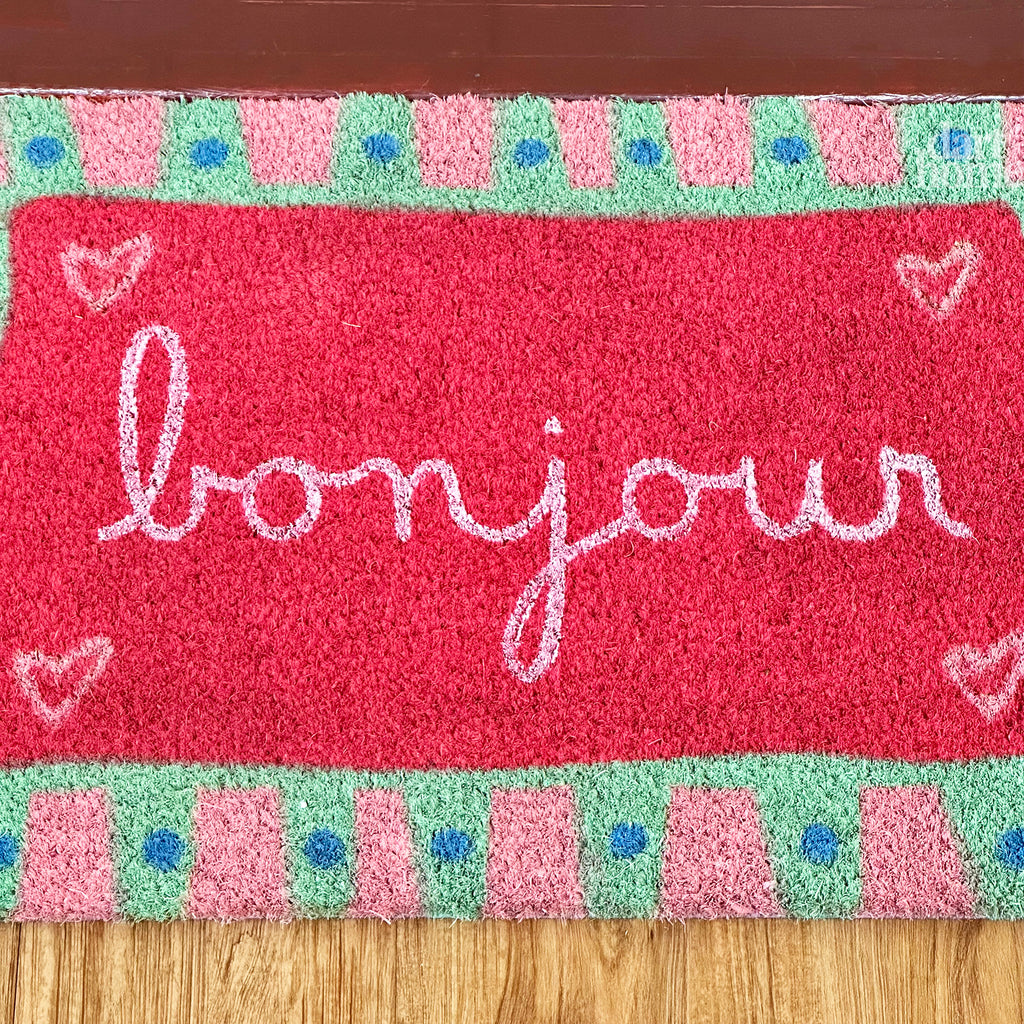 Rosa Fußmatte aus Kokosfaser mit Bonjour-Schriftzug