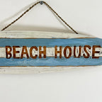 Hängendes Strandhaus-Surfbrett-Schild