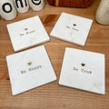 Set mit 4 inspirierenden Be-Marmor-Untersetzern