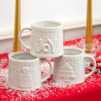 Set Of 3 Reactive Glaze Embossed Christmas Mugs