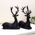 Set Of 2 Black Resin Sitting Reindeer Ornaments
