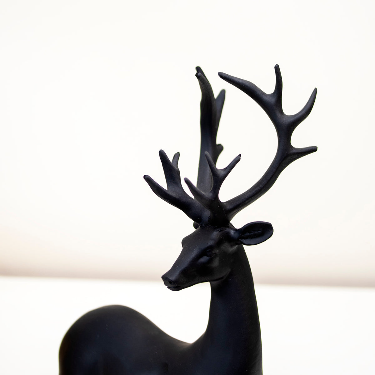 Set Of 2 Black Resin Sitting Reindeer Ornaments