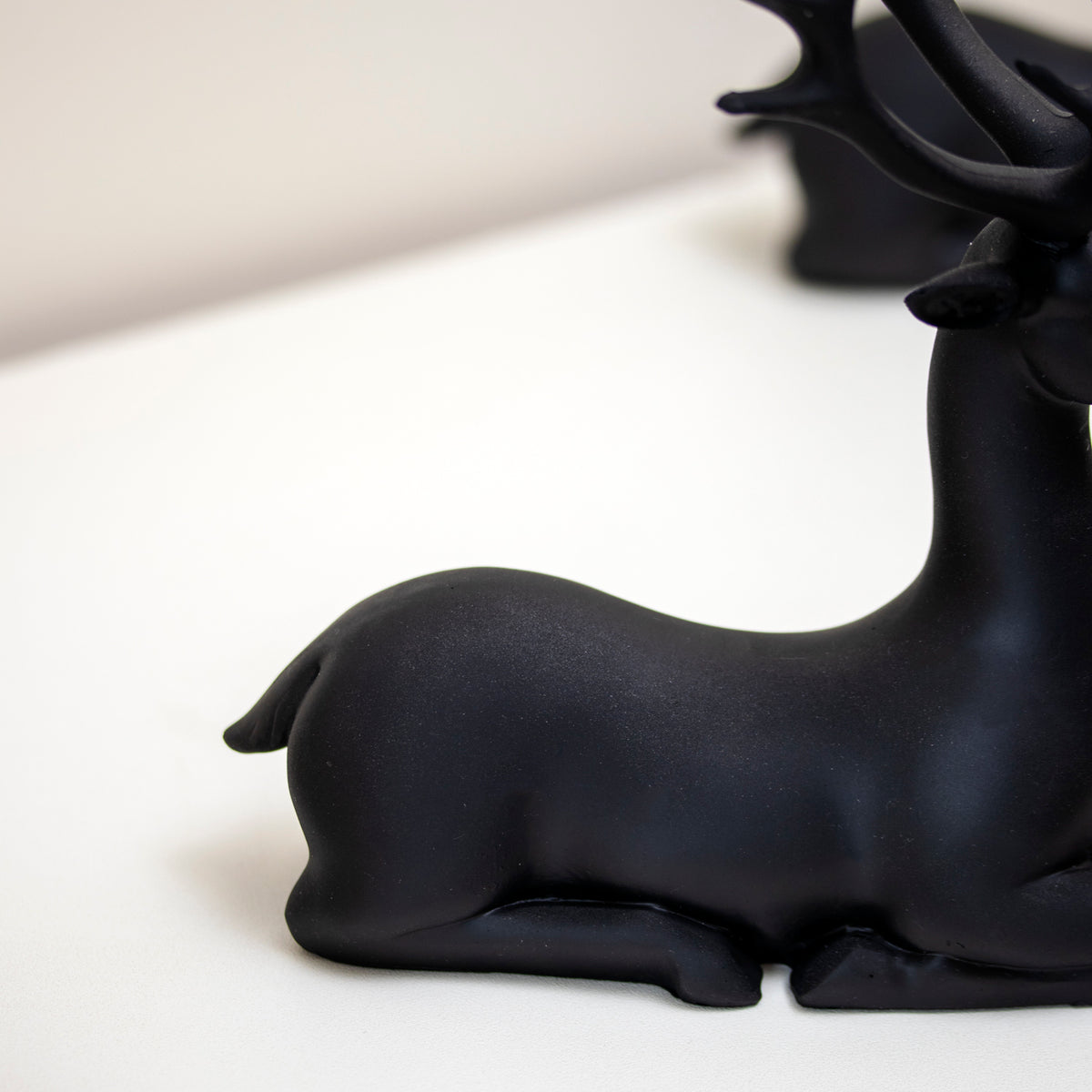 Set Of 2 Black Resin Sitting Reindeer Ornaments