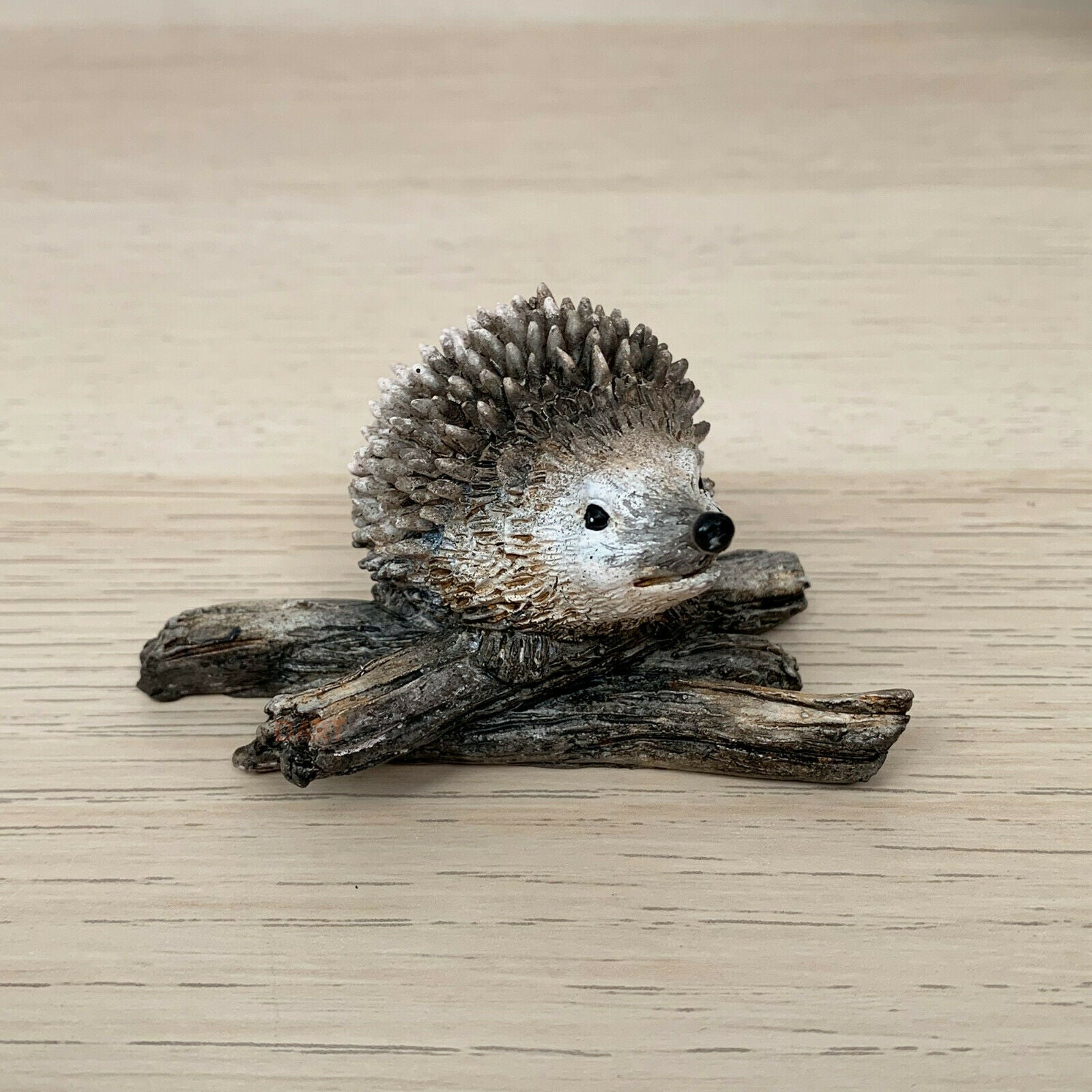 Miniature Pair Of Hedgehogs On Branch