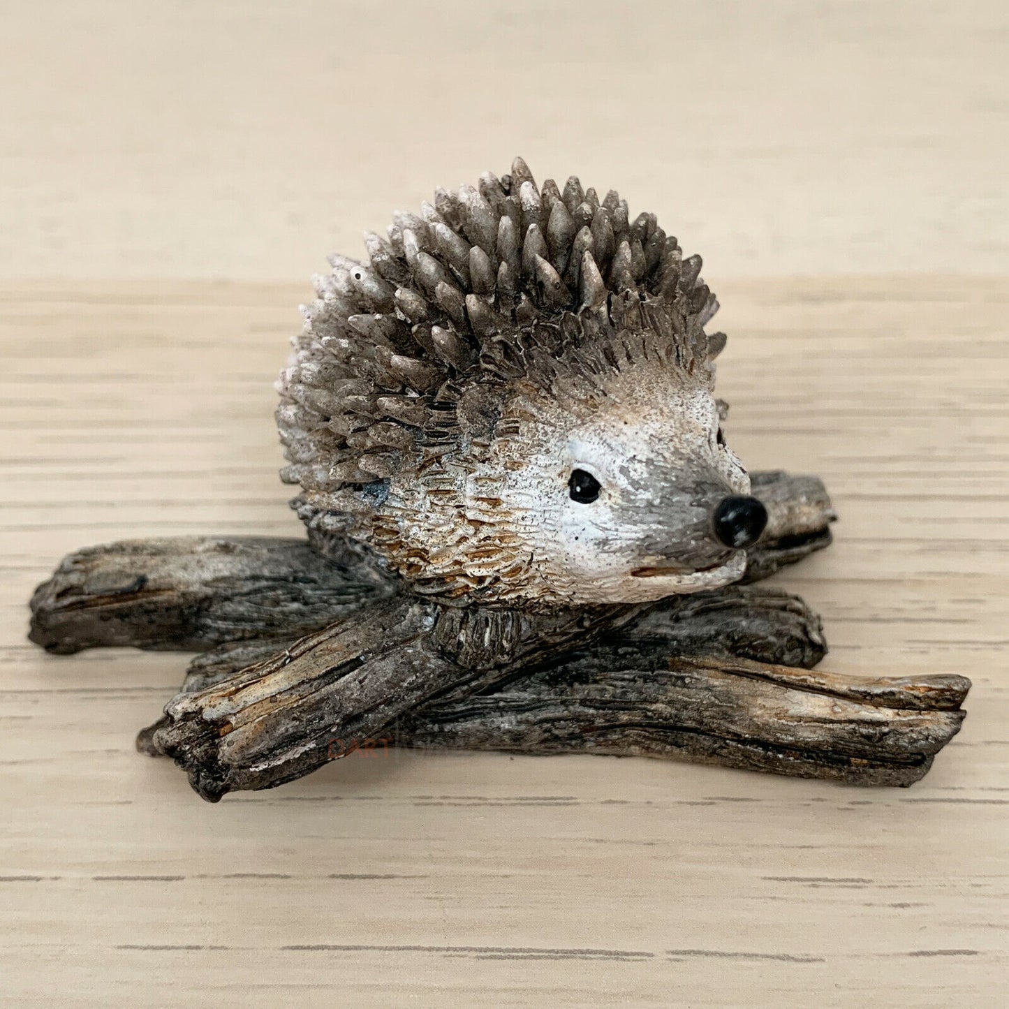 Miniature Pair Of Hedgehogs On Branch